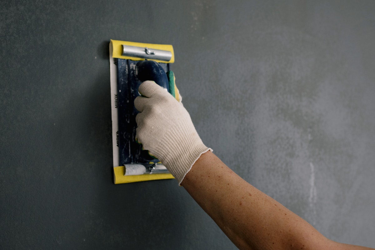 man fixing a wall